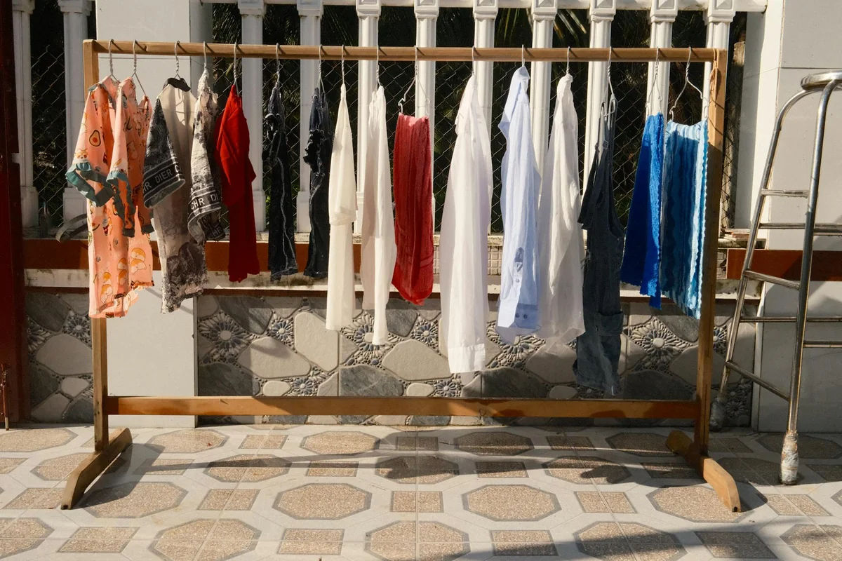 A variety of colorful clothes hanging to dry in the sunlight of Bến Tre, Vietnam.